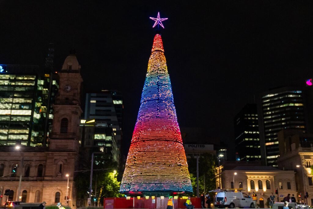 City of Adelaide Christmas tree in Victoria Square lit up in rainbow colours at night