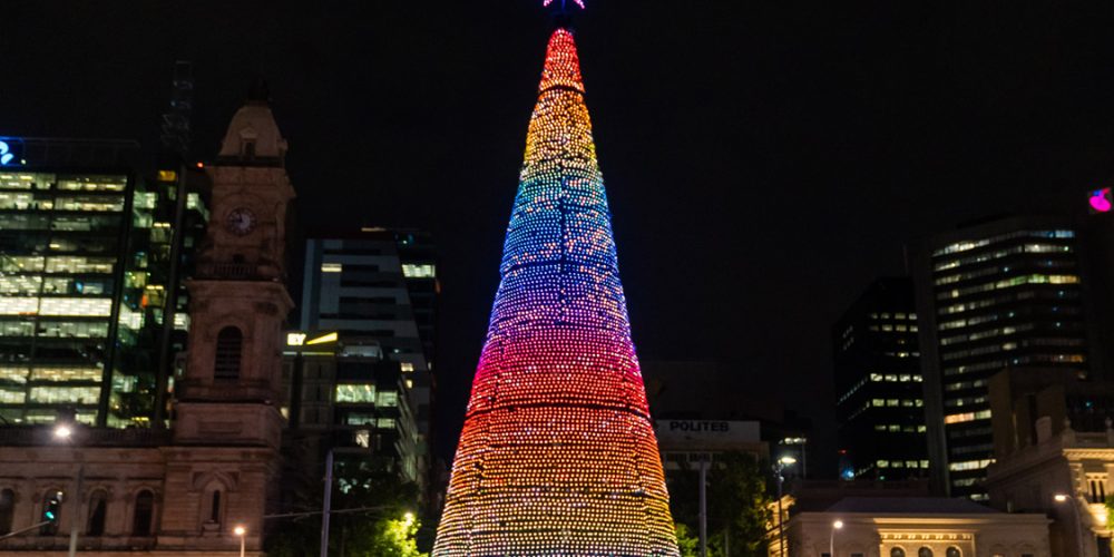 City of Adelaide Christmas tree in Victoria Square lit up in rainbow colours at night